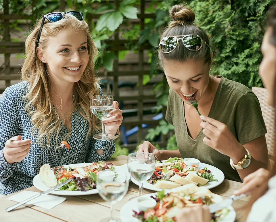 Happy women enjoying healthy meal